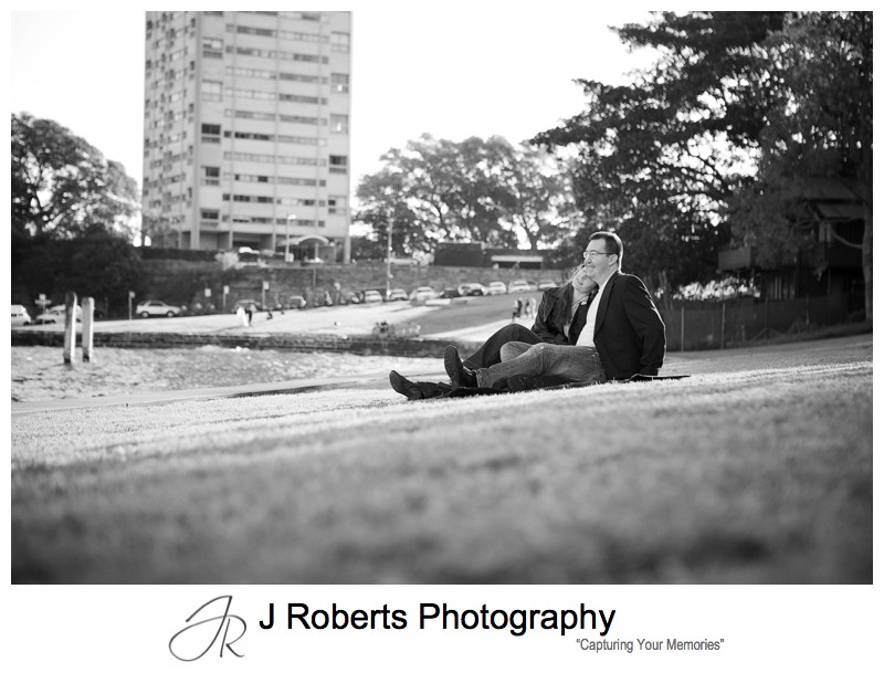 Couple sitting on rug at Blues Point Reserve - pre wedding portraits sydney